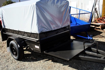 Trailer with canopy and mover ramp