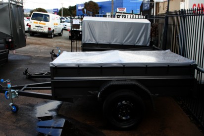 Trailer with tonneau cover