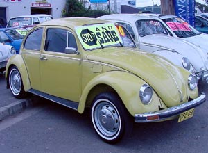 Front view of orange 1970s Beetle.
