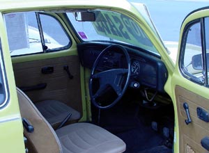 Interior view of orange 1970s Beetle.